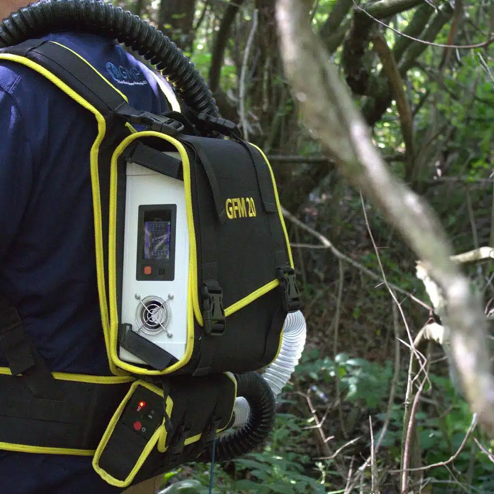 A man wearing the Addglobe Gas Flow Meter with Methane Laser Sensor Module Assembly